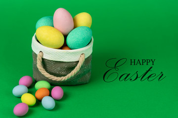 Colorful easter eggs with ceramic basket concept.