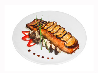 Grilled seafood salmon with shiitake mushrooms, red pepper and green onion on white round plate