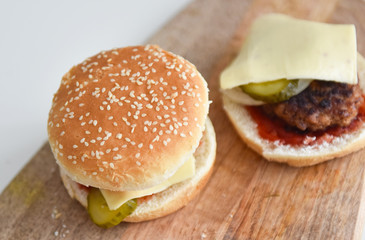 wheat bun with sesame seeds on a wooden table hamburger ingredients