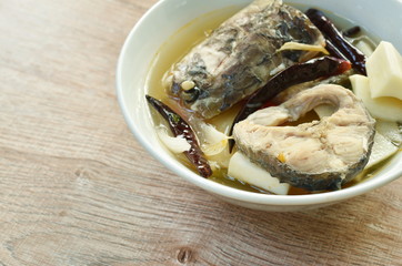 spicy boiled snake head fish and slice coconut shoot in tom yum soup on bowl