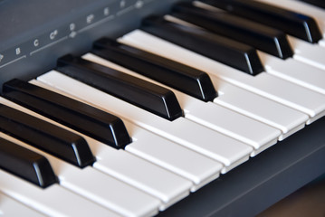 Naklejka premium Electronic musical keyboard synthesizer close-up