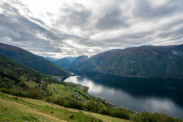 Fototapeta na wymiar Fjords of Aurland on a cloudy day with mountains in the distance