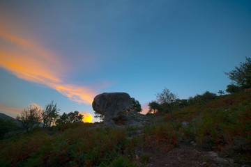 sunset in the desert waiting for the starry sky with hills in summer
