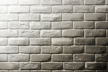 White brick textured wall, gradient transition to black dirty brickwork