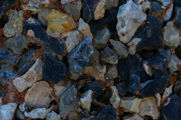 Multi colored stones texture on wall for background