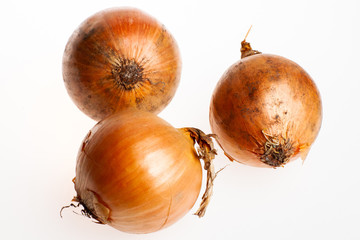 Studio shot of onions isolated on white background. Healthcare and alternative medicine, vitamin consumption for immune system. 