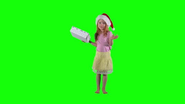 Curious redhead girl with gift box and christmas hat. Chroma key background