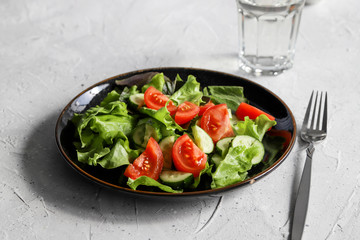 Summer fresh detox salad and water glass. Healthy diet food concept