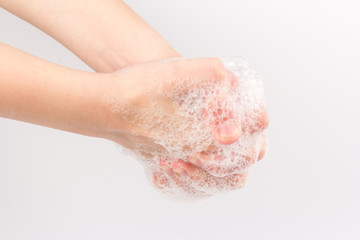 Closeup of children washing hands isolated. Cleanliness and body care concept. Global Handwashing Day Concept/Washing hands with soap