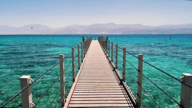 A push in shot of a dock at the Red Sea