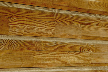 Creative wooden background with the technology of splicing dies of wood along the length. Flat lacquered wood background