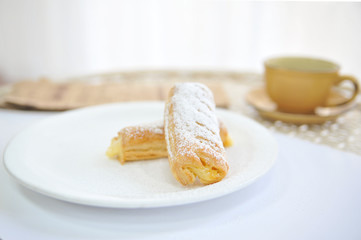 Puff with condensed milk. Coffee desserts. Delicious dessert with coffee.