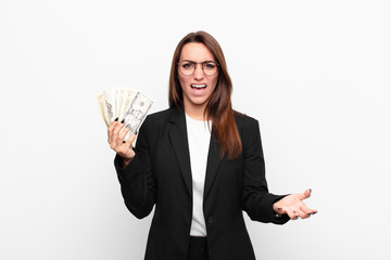 young businesswoman looking angry, annoyed and frustrated screaming wtf or what‚Äôs wrong with...