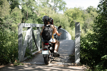 A couple on an electric bike in nature