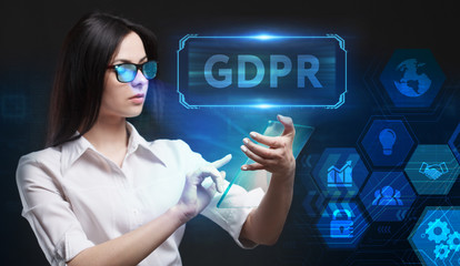 Business, Technology, Internet and network concept. Young businessman working on a virtual screen of the future and sees the inscription: GDPR