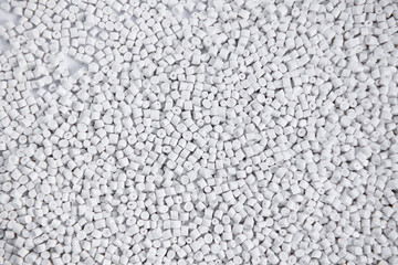 Polypropylene granule close-up background texture. plastic resin ( Masterbatch).Grey chemical granules for industrial plastic production