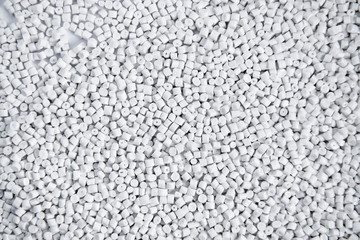 Polypropylene granule close-up background texture. plastic resin ( Masterbatch).Grey chemical granules for industrial plastic production