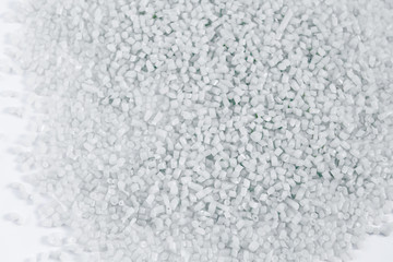 Polypropylene granule close-up background texture. plastic resin ( Masterbatch).Grey chemical granules for industrial plastic production