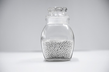 Polypropylene granule close-up background texture. plastic resin ( Masterbatch).Grey chemical granules for industrial plastic production