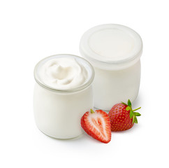 Organic yogurt in a glass jars with fresh beautiful strawberries isolated on white background.