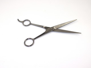 Professional scissors for haircuts isolated on white background.