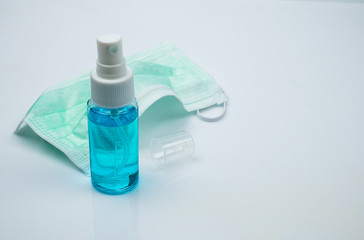 Hygienic face mask and Alcohol Sanitizer hand spray cleaners for anti Bacteria and virus on White Background.Coronavirus or COVID-19 prevention concept