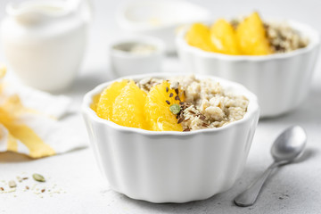 Overnight citrus oatmeal porridge. Selective focus, copy space.