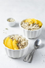Oatmeal healthy breakfast with fruit and seeds. Selective focus, copy space.