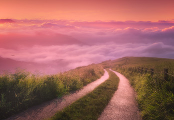 landscape background of morning path on foggy mountains