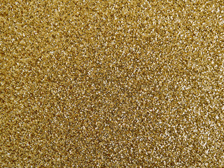 Glitter gold background. Horizontal frame. Flat lay. Copy space.