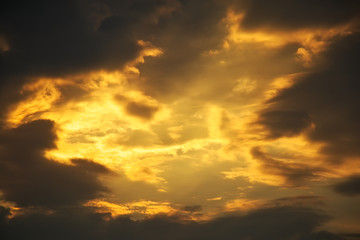 Naklejka na ściany i meble Beautiful stormy sunset sky. Cloudy abstract background. Sunset colors.