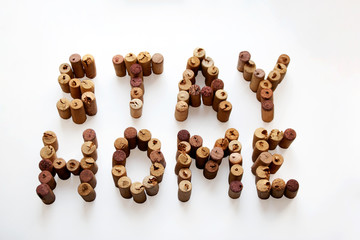 COVID-19 Stay home message composed from wine corks isolated on white background