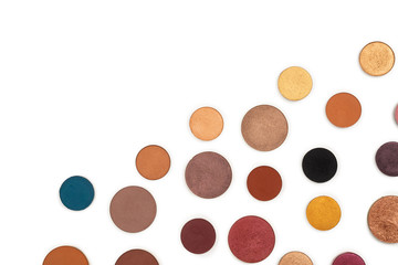 Round multicolored make up eyeshadows isolated on white.