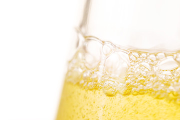 Carbonated drink close-up. Beer, lemonade. Detailed closeup. Bubbles in a liquid.