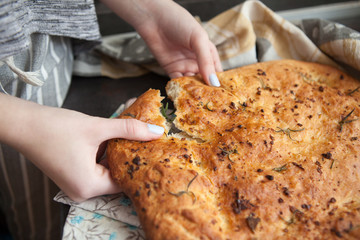 Traditional Italian Focaccia with rosemary and garlic - homemade flat bread focaccia