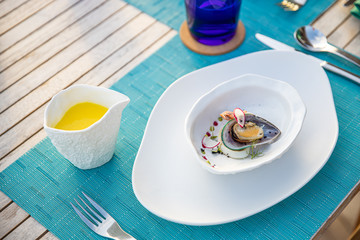 Fresh oysters with black caviar. Opened oysters with black sturgeon caviar and lemon, Gourmet food in restaurant. Delicatessen