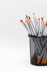 gray wooden pencils with colored rods on a white background