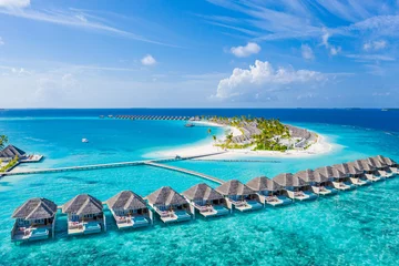 Photo sur Plexiglas Bleu Jeans Perfect aerial landscape, luxury tropical resort or hotel with water villas and beautiful beach scenery. Amazing bird eyes view in Maldives, landscape seascape aerial view over a Maldives
