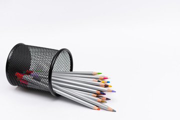 gray wooden pencils with colored rods on a white background