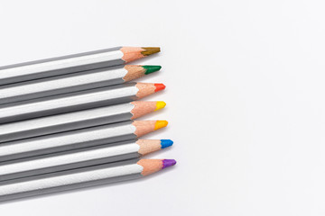 Fototapeta premium gray wooden pencils with colored rods on a white background