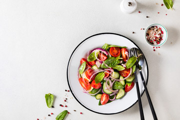 Fresh vegetable salad. Vegetarian food.Concept for a tasty and healthy meal.Top view.Copy space