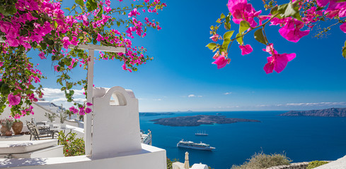 Flowers with white architecture on Santorini island, Greece. Beautiful summer landscape, sea view.....