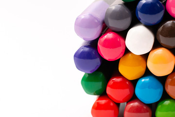 colored back of wooden gray pencils with colored rods on a white background