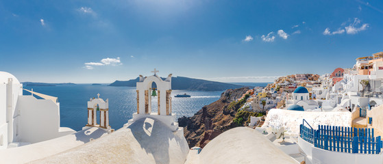 Summer travel and vacation destination landscape. Santorini, panorama of Oia and the Therasia...