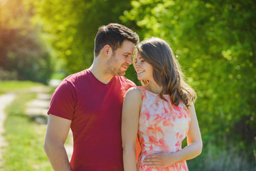 a lovely couple is enjoying sunny day outside