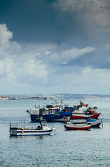 Fototapeta na wymiar Fishing boats floating in the fish port of Cascais - Portugal