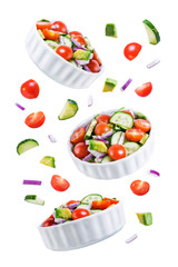 Cucumber tomato avocado red onion salad on a white isolated background