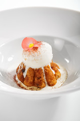 Rum baba with ice cream scoop