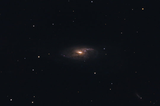 The intermediate spiral galaxy Messier 106 in the constellation Canes Venatici photographed with a Maksutov telescope from Mannheim in Germany.