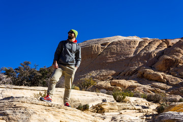 man tourist backpacker in red rock mountains landscape Red Rock Canyon National Conservation Area Nevada’s Mojave Desert